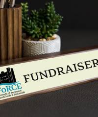  A desk plaque that reads "Fundraising Lead"